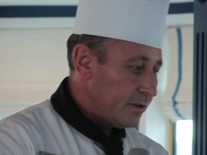 Chef Manuel, chef aboard the River Queen, narrates the Black Forest Cake demonstration