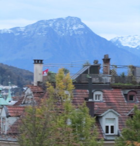 We caught this photo between two buildings and over a parked car in Lucerne